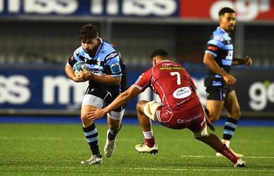 070123 - Cardiff v Scarlets - United Rugby Championship - Kirby Myhill of Cardiff is tackled by Dan Davis of Scarlets