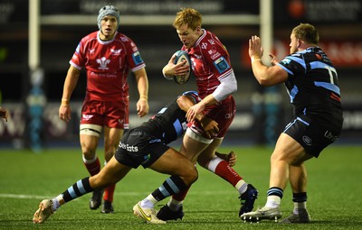 070123 - Cardiff v Scarlets - United Rugby Championship - Rhys Patchell of Scarlets is held