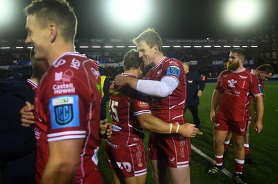 070123 - Cardiff v Scarlets - United Rugby Championship - Leigh Halfpenny and Rhys Patchell of Scarlets at the end of the game