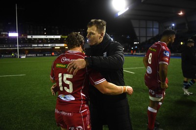 070123 - Cardiff v Scarlets - United Rugby Championship - Leigh Halfpenny and Liam Williams of Cardiff at the end of the game