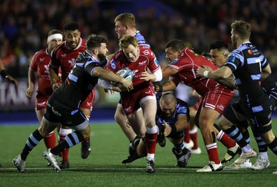 070123 - Cardiff Rugby v Scarlets - United Rugby Championship - Rhys Patchell of Scarlets is tackled by Kirby Myhill of Cardiff