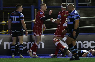 070123 - Cardiff Rugby v Scarlets - United Rugby Championship - Johnny McNicholl of Scarlets celebrates scoring a try