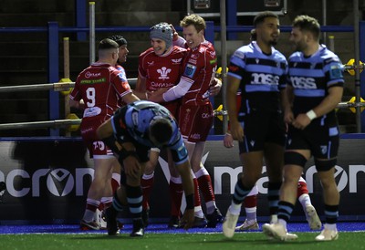 070123 - Cardiff Rugby v Scarlets - United Rugby Championship - Jonathan Davies of Scarlets celebrates scoring a try with team mates