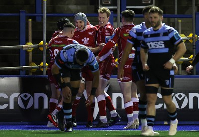 070123 - Cardiff Rugby v Scarlets - United Rugby Championship - Jonathan Davies of Scarlets celebrates scoring a try with team mates