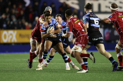 070123 - Cardiff Rugby v Scarlets - United Rugby Championship - Ben Thomas of Cardiff is tackled by Joe Roberts of Scarlets 