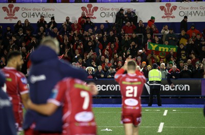 070123 - Cardiff Rugby v Scarlets - United Rugby Championship - Scarlets fans celebrate with the team at full time