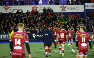 070123 - Cardiff Rugby v Scarlets - United Rugby Championship - Scarlets fans celebrate with the team at full time