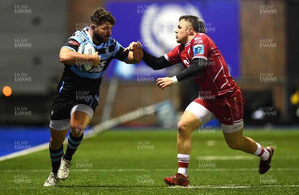 070123 - Cardiff v Scarlets - United Rugby Championship - Kirby Myhill of Cardiff is tackled by Steff Evans of Scarlets