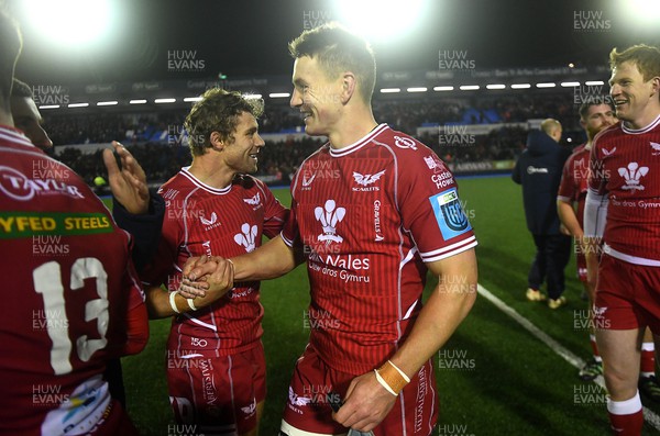 070123 - Cardiff v Scarlets - United Rugby Championship - Leigh Halfpenny and Jonathan Davies of Scarlets at the end of the game