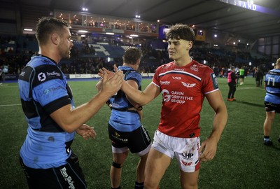 191225 - Cardiff Rugby v Scarlets - United Rugby Championship - George Nott of Cardiff and Eddie James of Scarlets at full time