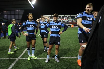 191225 - Cardiff Rugby v Scarlets - United Rugby Championship - Dejected Ben Thomas and Callum Sheedy of Cardiff 