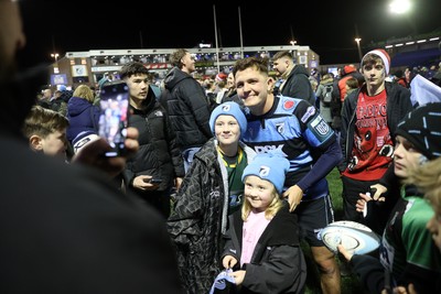 191225 - Cardiff Rugby v Scarlets - United Rugby Championship - Callum Sheedy of Cardiff with fans at full time