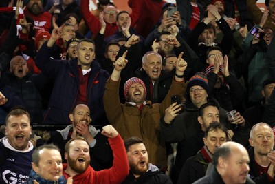191225 - Cardiff Rugby v Scarlets - United Rugby Championship - Scarlets celebrate with fans at full time