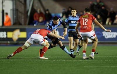 191225 - Cardiff Rugby v Scarlets - United Rugby Championship - George Nott of Cardiff is tackled by Fletcher Anderson of Scarlets 