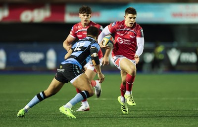 191225 - Cardiff Rugby v Scarlets, United Rugby Championship - Joe Hawkins of Scarlets takes on Ben Thomas of Cardiff Rugby