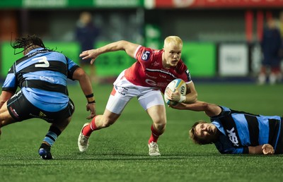 191225 - Cardiff Rugby v Scarlets, United Rugby Championship - Blair Murray of Scarlets is held as he looks to attack