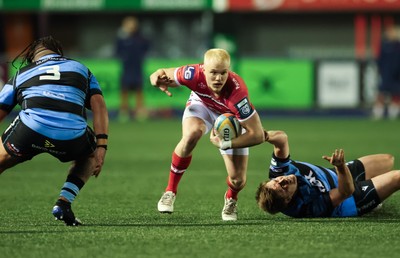 191225 - Cardiff Rugby v Scarlets, United Rugby Championship - Blair Murray of Scarlets is held as he looks to attack