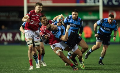 191225 - Cardiff Rugby v Scarlets, United Rugby Championship - Mason Grady of Cardiff Rugby is tackled by Sam Lousi of Scarlets