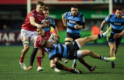 191225 - Cardiff Rugby v Scarlets, United Rugby Championship - Mason Grady of Cardiff Rugby is tackled by Sam Lousi of Scarlets