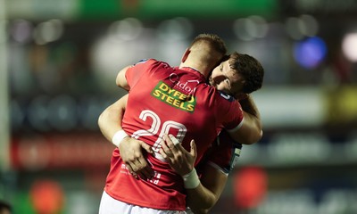191225 - Cardiff Rugby v Scarlets, United Rugby Championship - Jarrod Taylor of Scarlets and Johnny Williams of Scarlets at the end of the match