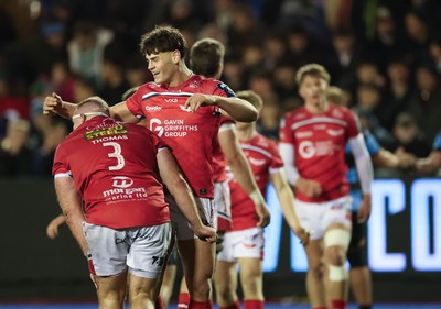 191225 - Cardiff Rugby v Scarlets, United Rugby Championship - Scarlets players celebrate at the end of the match