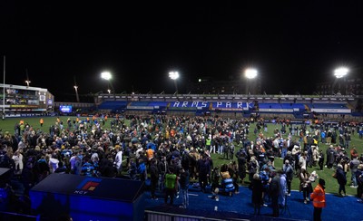 191225 - Cardiff Rugby v Scarlets, United Rugby Championship - Fans take to the Cardiff Arms Park pitch at the end of the match