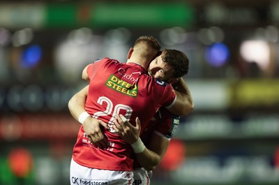 191225 - Cardiff Rugby v Scarlets, United Rugby Championship - Jarrod Taylor of Scarlets and Johnny Williams of Scarlets at the end of the match