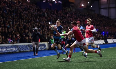 191225 - Cardiff Rugby v Scarlets, United Rugby Championship - Josh Adams of Cardiff Rugby scores try in front of a bumper derby crowd