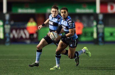 191225 - Cardiff Rugby v Scarlets, United Rugby Championship - Ben Thomas of Cardiff Rugby and Josh Adams of Cardiff Rugby