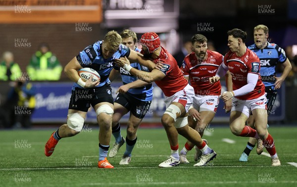 191225 - Cardiff Rugby v Scarlets - United Rugby Championship - Josh McNally of Cardiff is tackled by Josh Macleod of Scarlets 