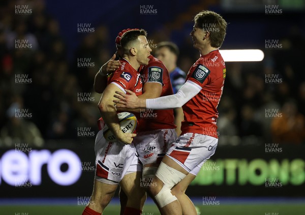 191225 - Cardiff Rugby v Scarlets - United Rugby Championship - Gareth Davies of Scarlets celebrates scoring a try with team mates