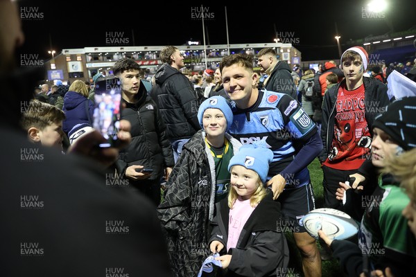 191225 - Cardiff Rugby v Scarlets - United Rugby Championship - Callum Sheedy of Cardiff with fans at full time