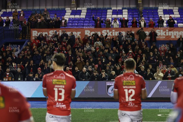 191225 - Cardiff Rugby v Scarlets - United Rugby Championship - Scarlets celebrate with fans at full time