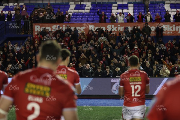 191225 - Cardiff Rugby v Scarlets - United Rugby Championship - Scarlets celebrate with fans at full time