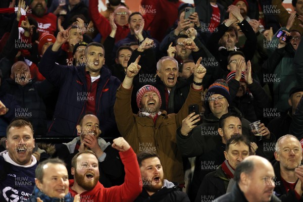 191225 - Cardiff Rugby v Scarlets - United Rugby Championship - Scarlets celebrate with fans at full time
