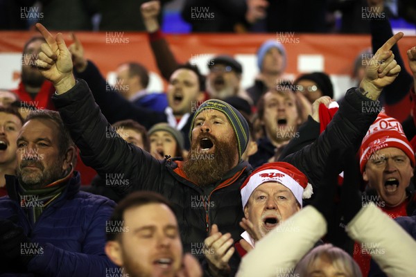191225 - Cardiff Rugby v Scarlets - United Rugby Championship - Scarlets celebrate with fans at full time