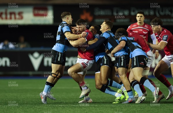 191225 - Cardiff Rugby v Scarlets, United Rugby Championship - Johnny Williams of Scarlets is held