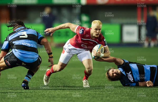 191225 - Cardiff Rugby v Scarlets, United Rugby Championship - Blair Murray of Scarlets is held as he looks to attack