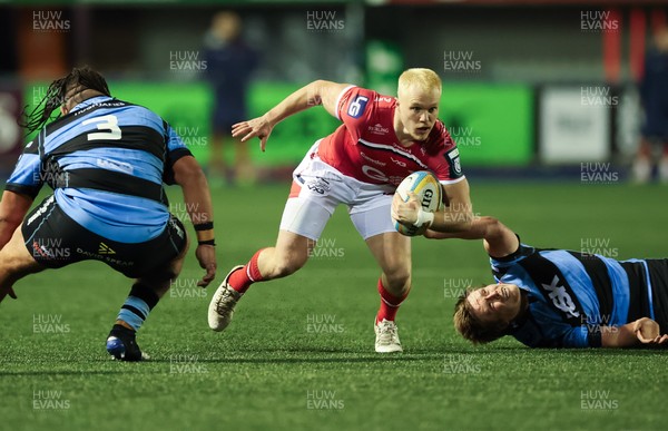 191225 - Cardiff Rugby v Scarlets, United Rugby Championship - Blair Murray of Scarlets is held as he looks to attack