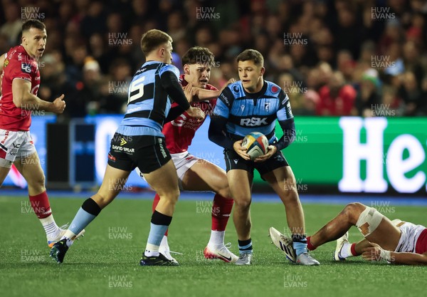 191225 - Cardiff Rugby v Scarlets, United Rugby Championship - Callum Sheedy of Cardiff Rugby is held