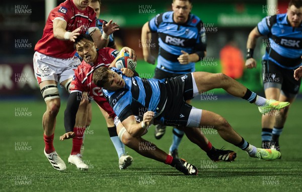 191225 - Cardiff Rugby v Scarlets, United Rugby Championship - Mason Grady of Cardiff Rugby is tackled by Sam Lousi of Scarlets