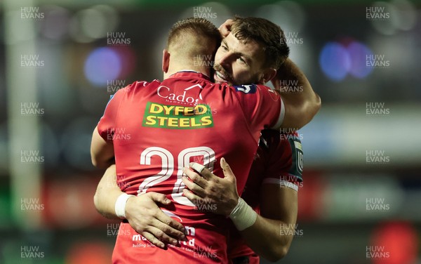 191225 - Cardiff Rugby v Scarlets, United Rugby Championship - Jarrod Taylor of Scarlets and Johnny Williams of Scarlets at the end of the match