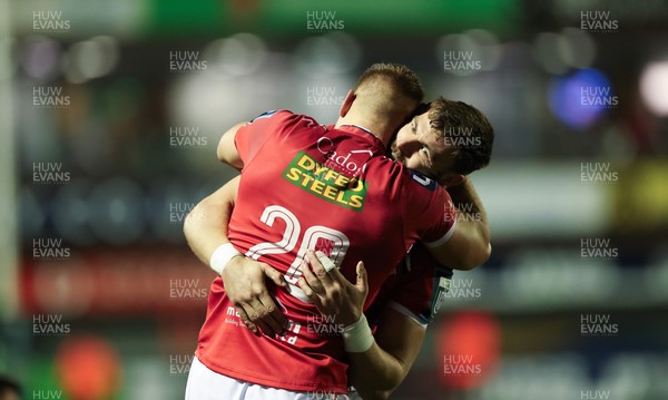 191225 - Cardiff Rugby v Scarlets, United Rugby Championship - Jarrod Taylor of Scarlets and Johnny Williams of Scarlets at the end of the match
