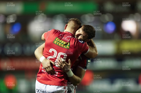 191225 - Cardiff Rugby v Scarlets, United Rugby Championship - Jarrod Taylor of Scarlets and Johnny Williams of Scarlets at the end of the match