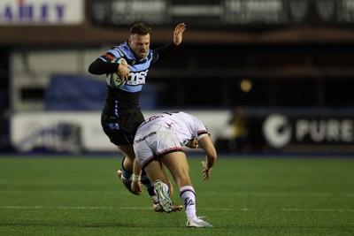 040323 - Cardiff Rugby v Ulster - United Rugby Championship - Owen Lane of Cardiff rugby is tackled by Stewart Moore of Ulster 