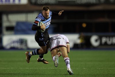 040323 - Cardiff Rugby v Ulster - United Rugby Championship - Owen Lane of Cardiff rugby is tackled by Stewart Moore of Ulster 