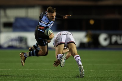 040323 - Cardiff Rugby v Ulster - United Rugby Championship - Owen Lane of Cardiff rugby is tackled by Stewart Moore of Ulster 