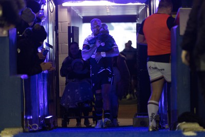 040323 - Cardiff Rugby v Ulster, BKT United Rugby Championship - Rey Lee-Lo of Cardiff Rugby and his family lead the team out on the occasion of his 150th cap for the region