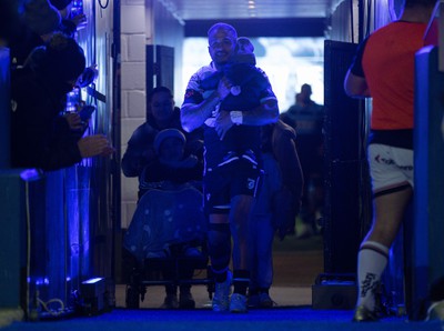 040323 - Cardiff Rugby v Ulster, BKT United Rugby Championship - Rey Lee-Lo of Cardiff Rugby and his family lead the team out on the occasion of his 150th cap for the region