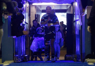 040323 - Cardiff Rugby v Ulster, BKT United Rugby Championship - Rey Lee-Lo of Cardiff Rugby and his family lead the team out on the occasion of his 150th cap for the region